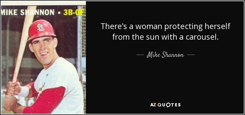 There's a woman protecting herself from the sun with a carousel. - Mike Shannon